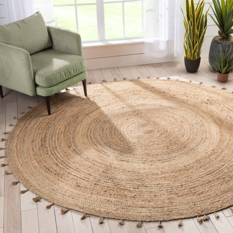 Gevlochten rond jute vloerkleed met kwastjes